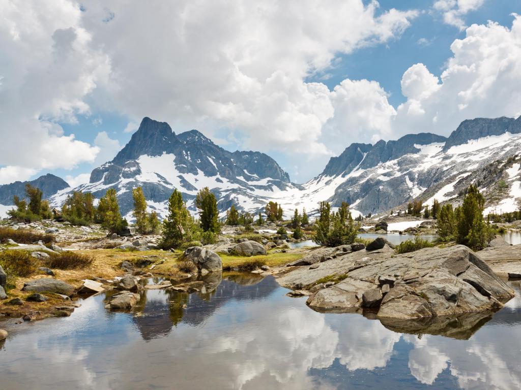 Clear waters running through mountains and trees