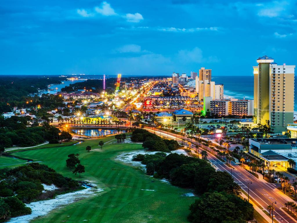 Panama City Beach, Florida, USA with a view of Front Beach Road at night during blue hour.