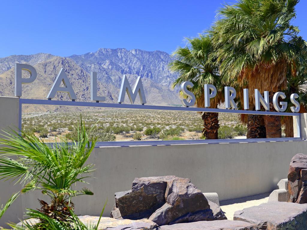 Palm Springs sign with desert background and backdrop of San Jacinto Mountain, California