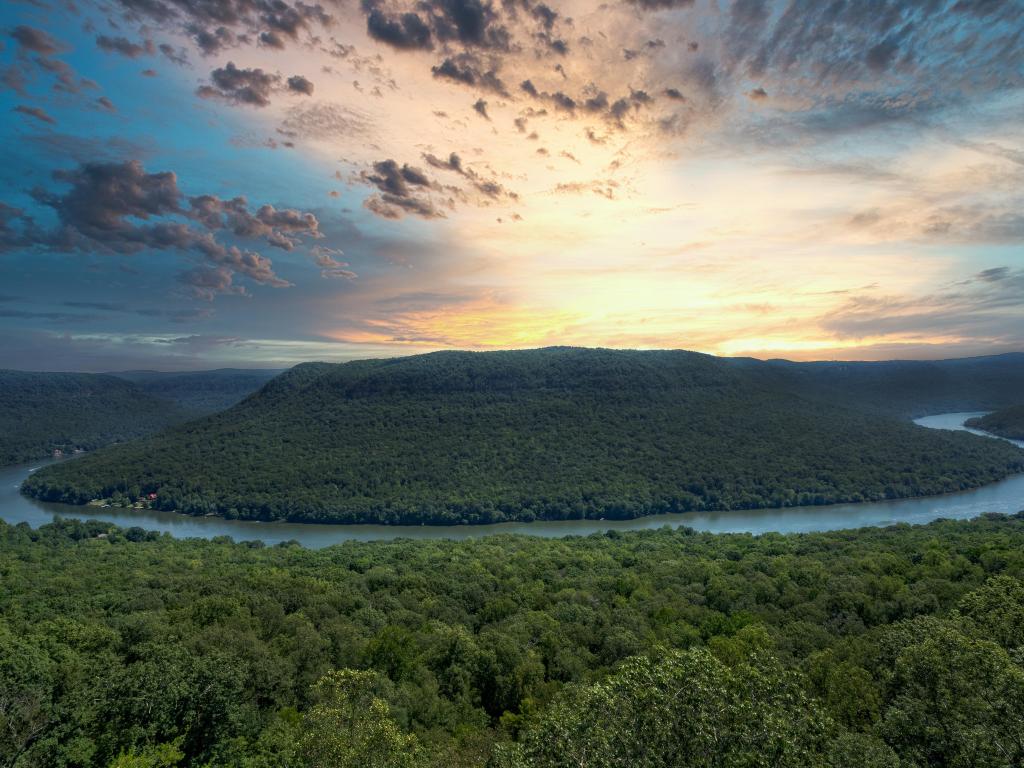 Prentice Cooper State Forest, Tennessee, USA with a sunrise at Snoopers Rock Overlook near Chattanooga and Dunlap with trees and the Tennessee River flowing through the valley.
