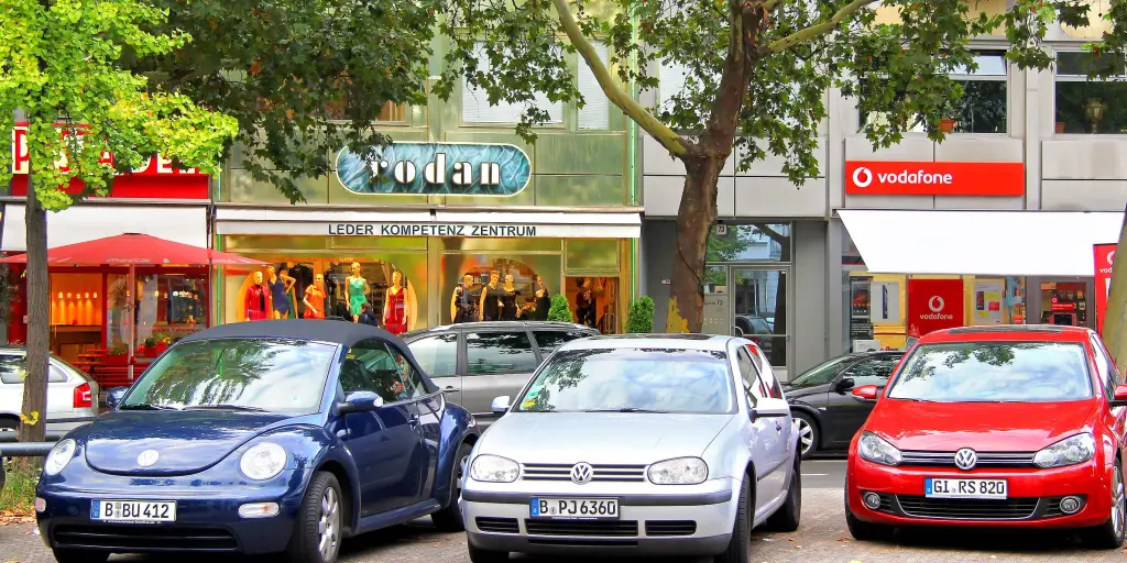A row of Volkswagen cars parked infront of a shop in Germany