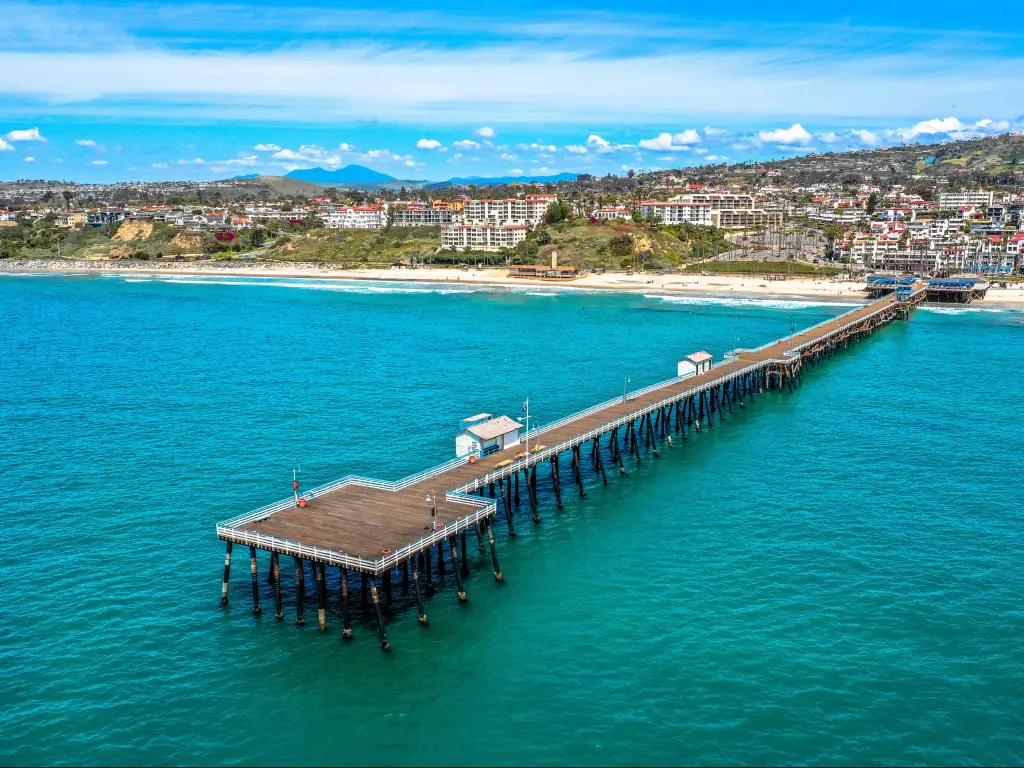 San Clemente Pier, Carlsbad, CA, USA Drone Shot of San Clemente Pier taken on a sunny day with the city in the distance.