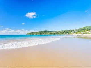 Golden sand on Noosa's Main beach on a clear and sunny day on the Sunshine Coast in Queensland, Australia