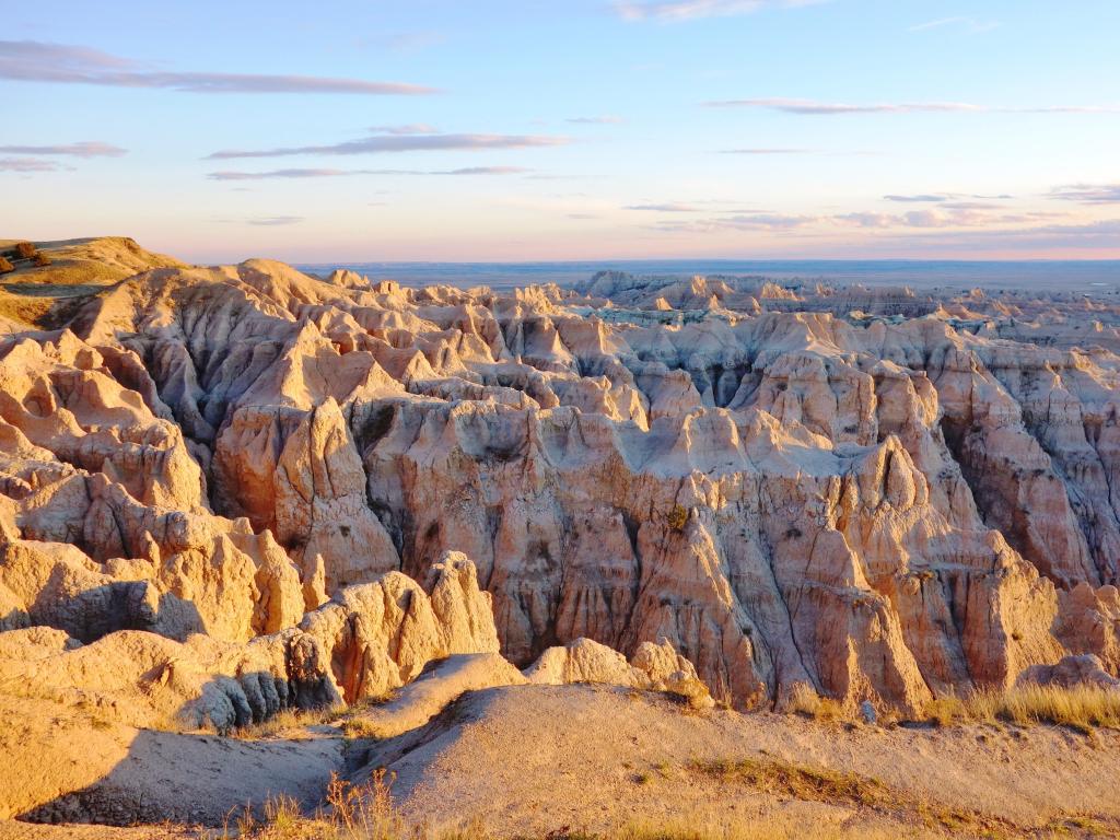 Badlands National Park, USA taken just before sunset with the rocky terrain in the foreground. 