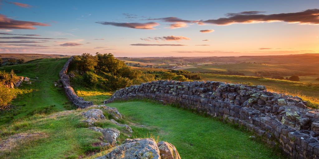 The sun sets over Hadrian's Wall in the beautiful Northumberland National Park