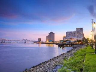 New Orleans, Louisiana, USA taken at the downtown city with the Missisippi River at twilight.