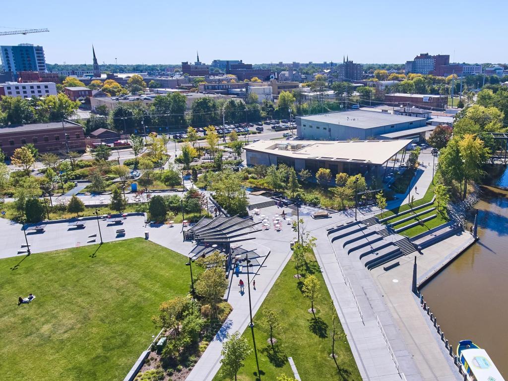Fort Wayne, Indiana, USA with an aerial view of Promenade Park in downtown Fort Wayne taken on a sunny day with grass and trees in the foreground. 