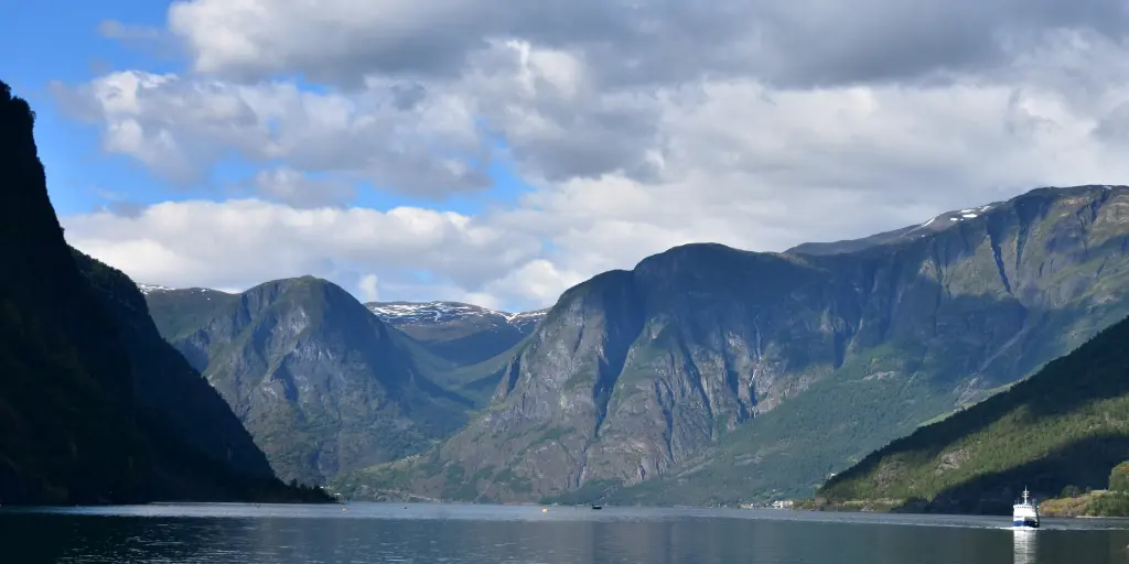 A ferry sails along a fjord near Flam, Norway