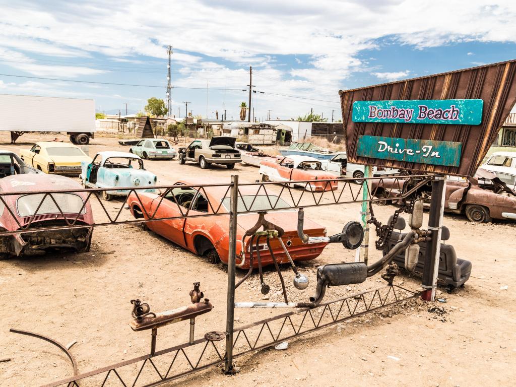 Abandoned and rusted vintage cars sit at Bombay Beach Drive In, at Salton Sea, California