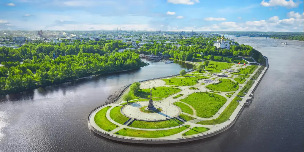 An aerial view of Strelka park jutting out into the water of the Kotorosl and Volga rivers, which meet here. A statue can be seen at the front of the park.
