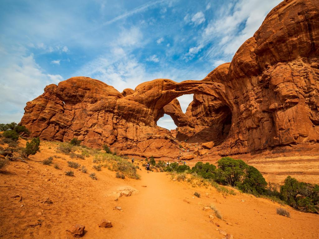 Arches National Park, Moab, USA with a view of the Double Arch Canyon against a blue sky.