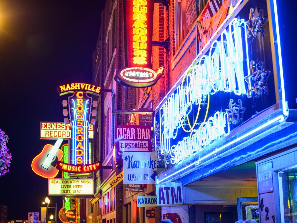 Nashville, Tennessee, USA with the Honky-tonks on Lower Broadway taken at night with neon lights.