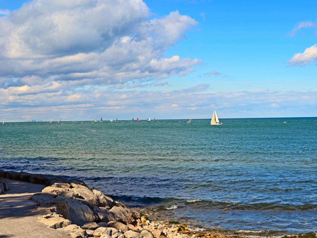 Lake Ontario, Canada with boats racing in the water on a sunny day.