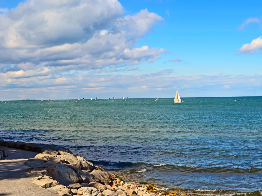 Lake Ontario, Canada with boats racing in the water on a sunny day.