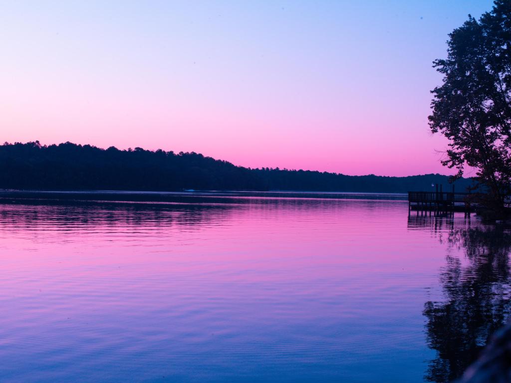 A stunning purple sunrise over still Lake Wateree, NC