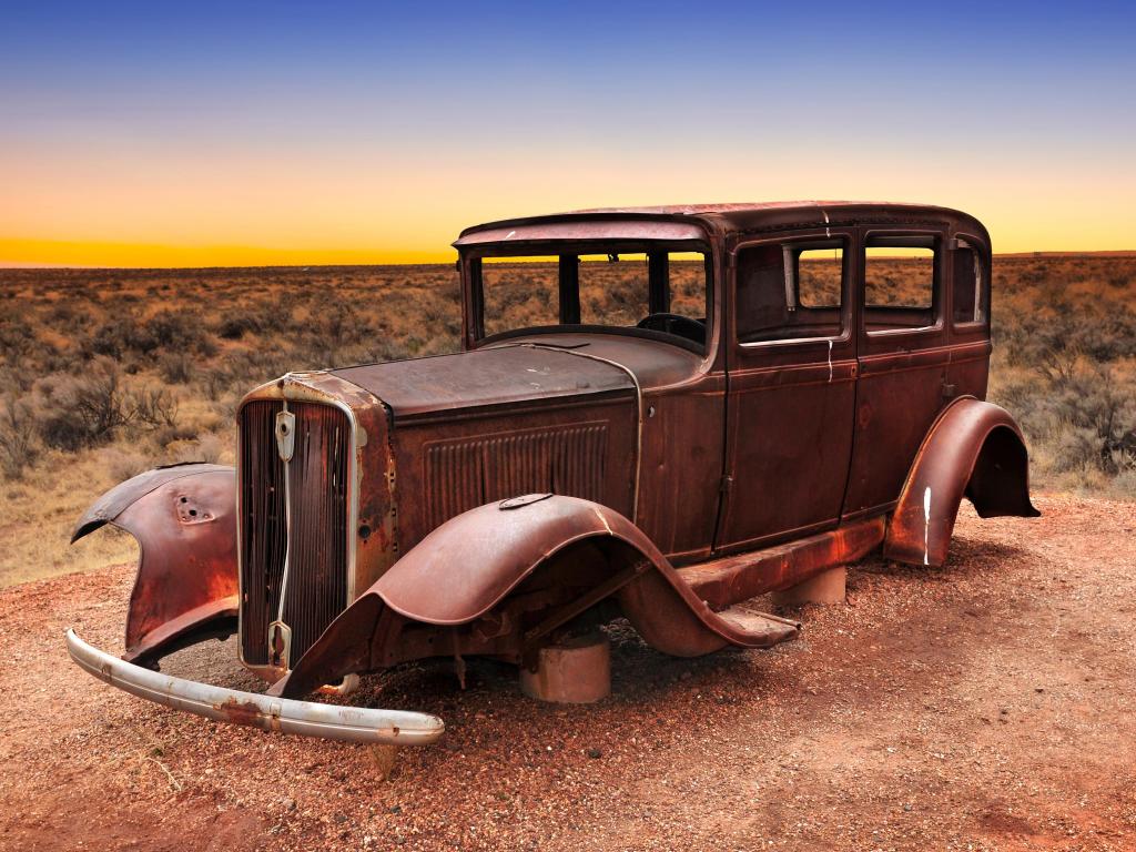 Route 66 vintage car relic displayed near the north entrance of Petrified Forest National Park in Arizona, USA.