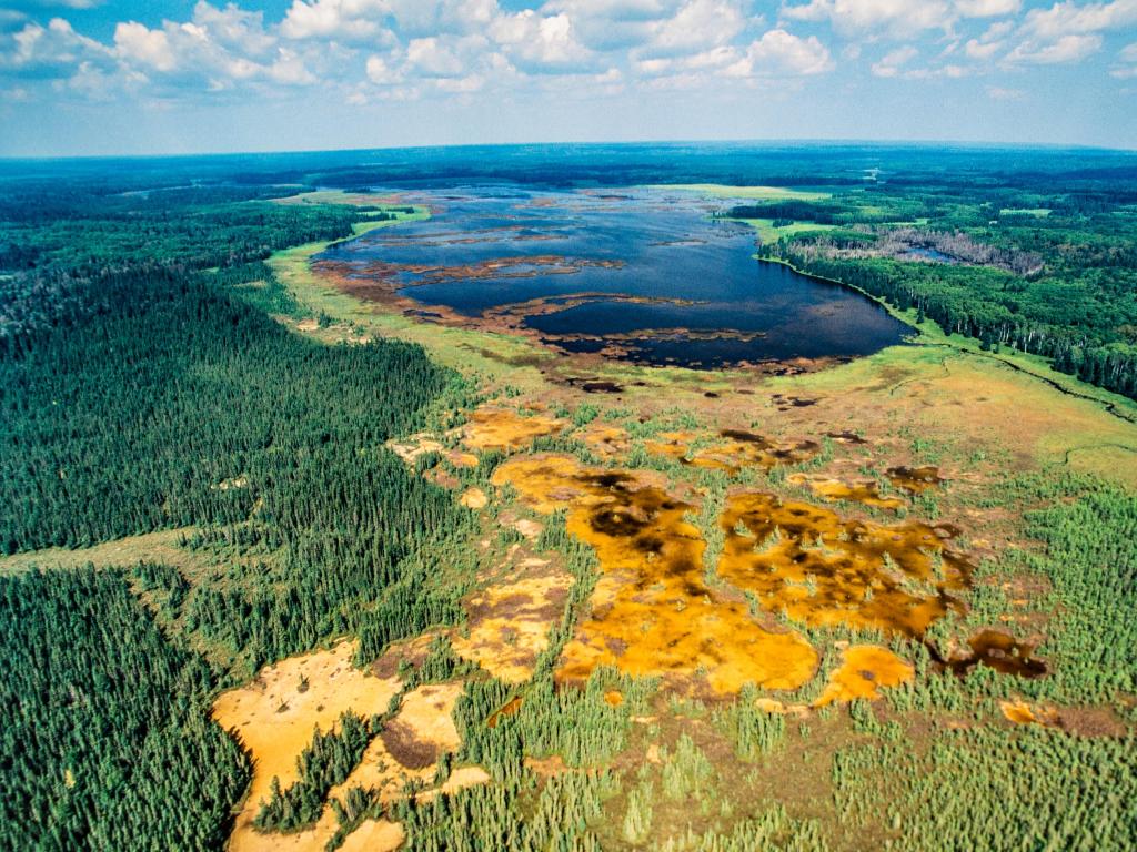 Riding Mountain National Park, Manitoba, Canada taken from high looking down at the vast lake and forests, stunning colours of the landscape on a sunny day.