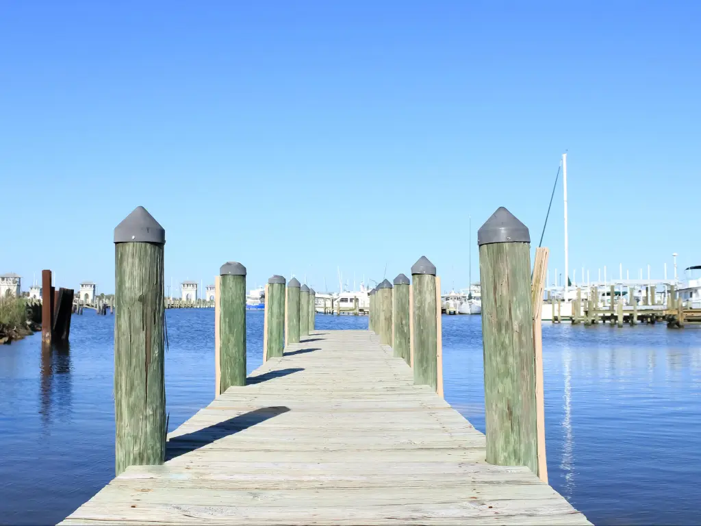 Clear blue skies across the wooden dock in Gulfport, Mississippi