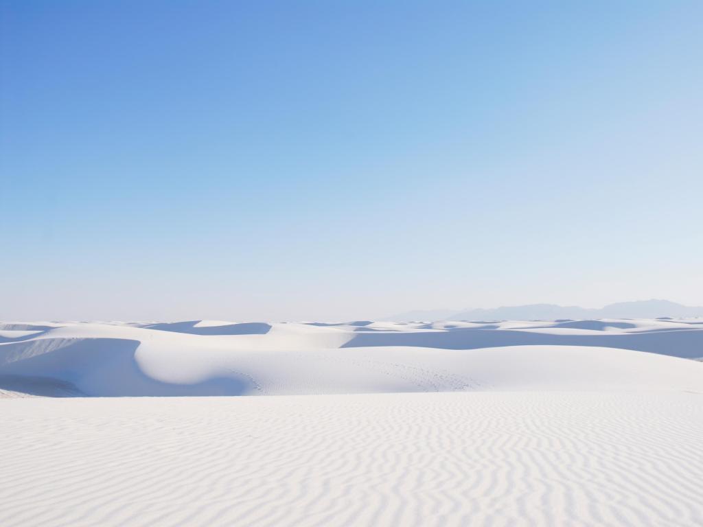 Beautiful expansive white sand dunes under the blue sky