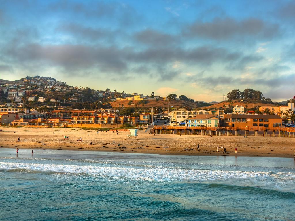 Sun setting on Pismo beach pier at Pismo Beach, California, USA