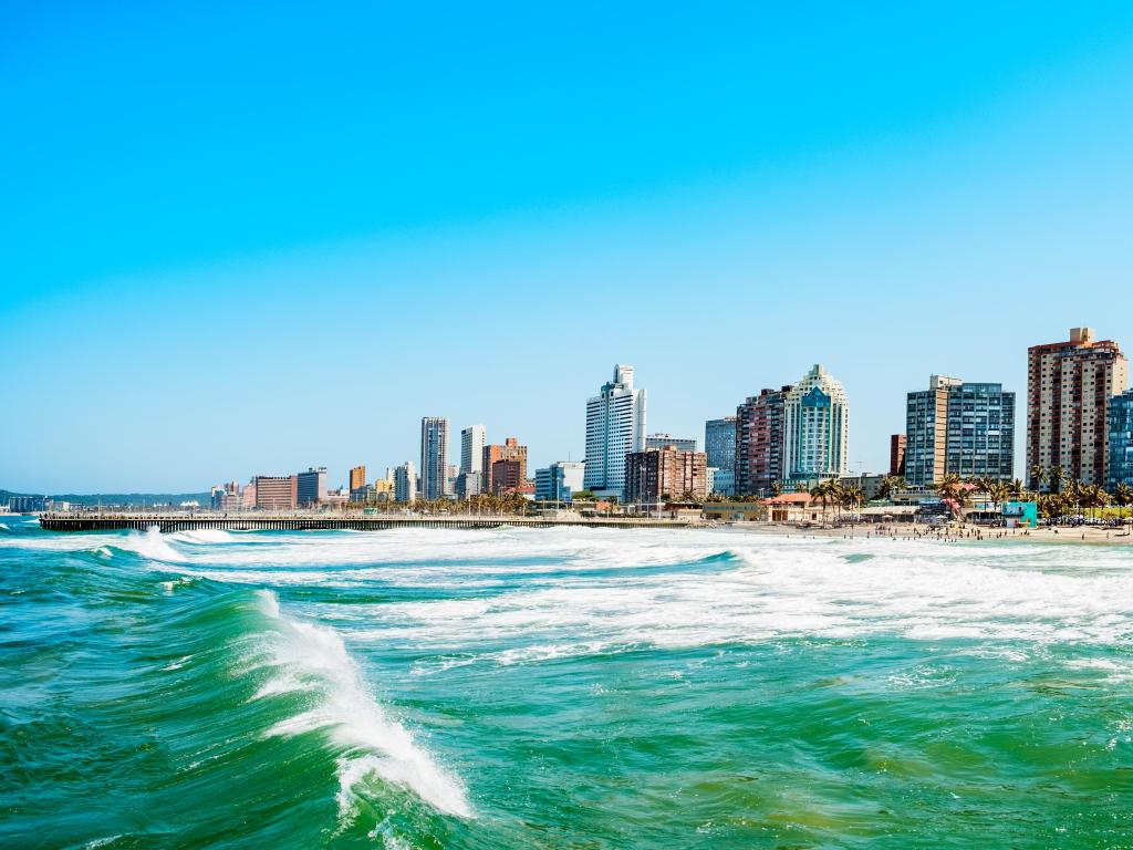 Panorama photo of Durban South Africa. Big waves crossing the scene