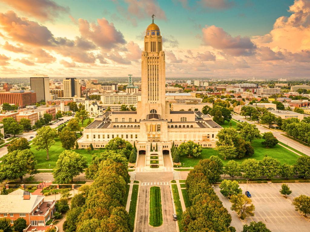 Lincoln skyline and Nebraska State Capitol. The Nebraska State Capitol is the seat of government for the U.S. state of Nebraska and is located in downtown Lincoln.