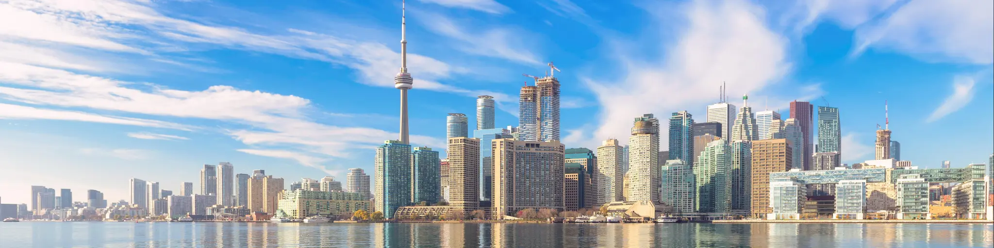 Beautiful Toronto skyline with CN Tower over lake. Canada.