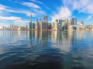 Beautiful Toronto skyline with CN Tower over lake. Canada.
