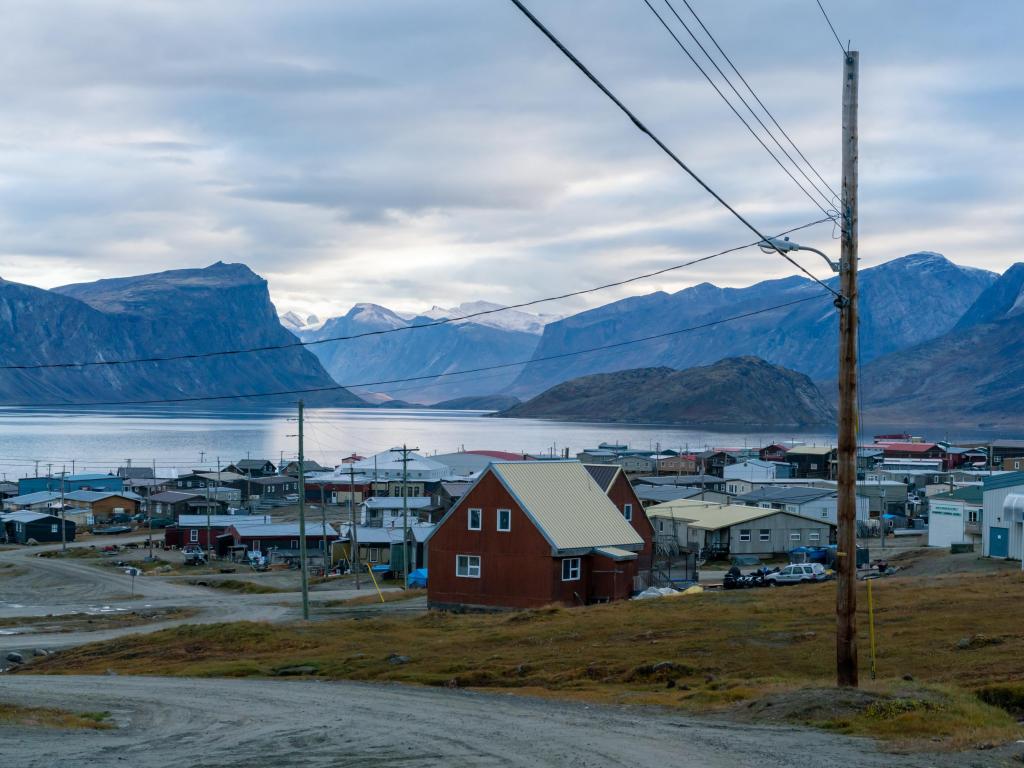 A remote community in Nunavut, Canada, with the Pangnirtung Fjord behind the houses