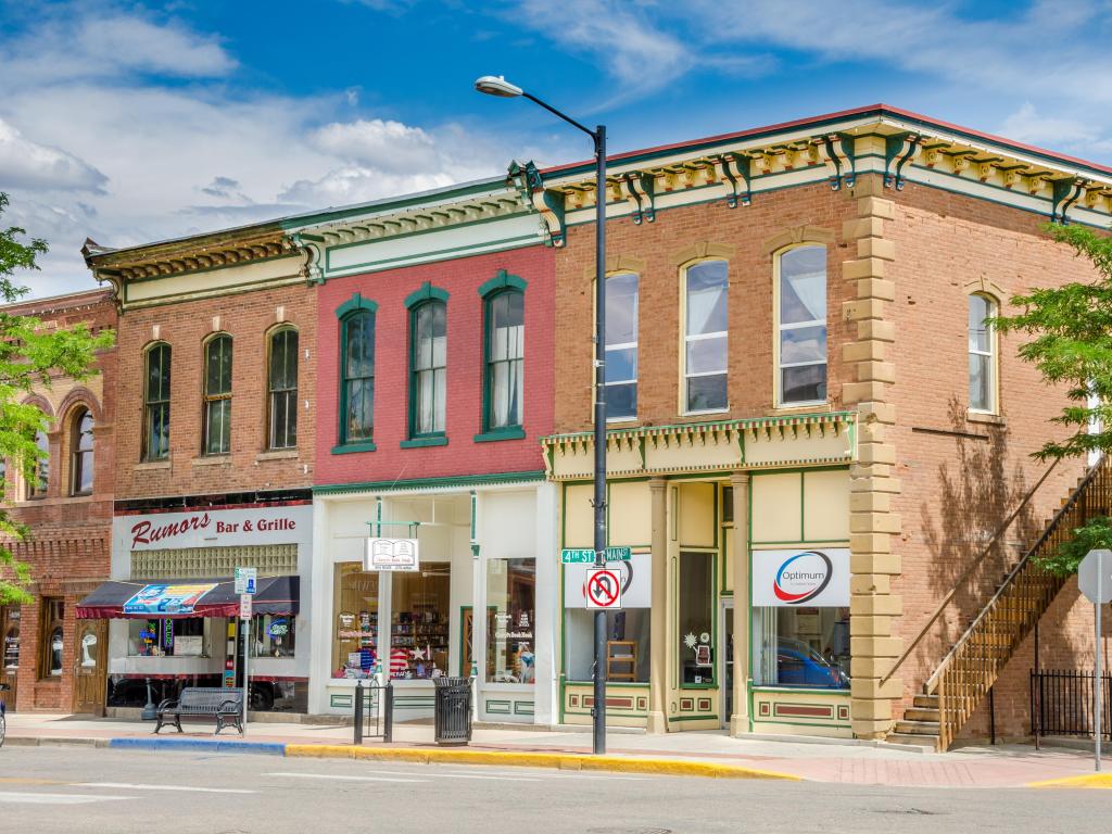 Colorful historic shop fronts in Canon City's downtown area in Colorado, on a sunny day