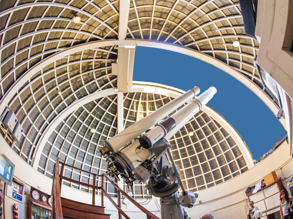 View of a telescope pointing at the sky at Griffith Observatory, LA