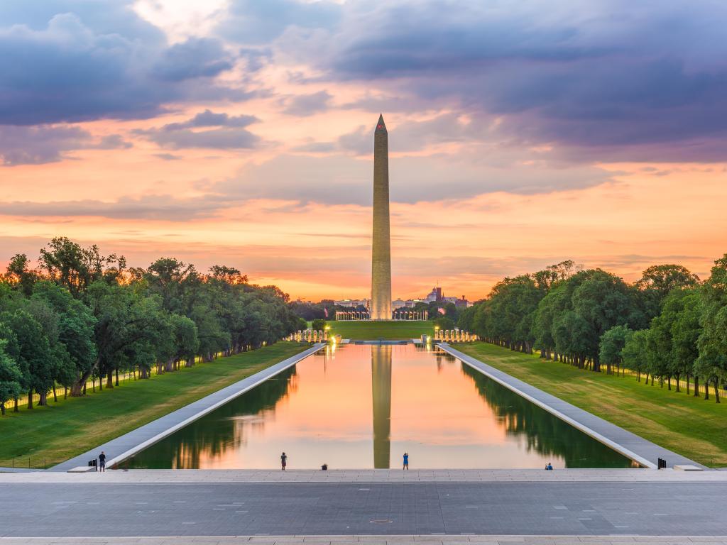 Washington Monument, Washington DC, USA with the Reflecting Pool in the foreground taken at dawn.