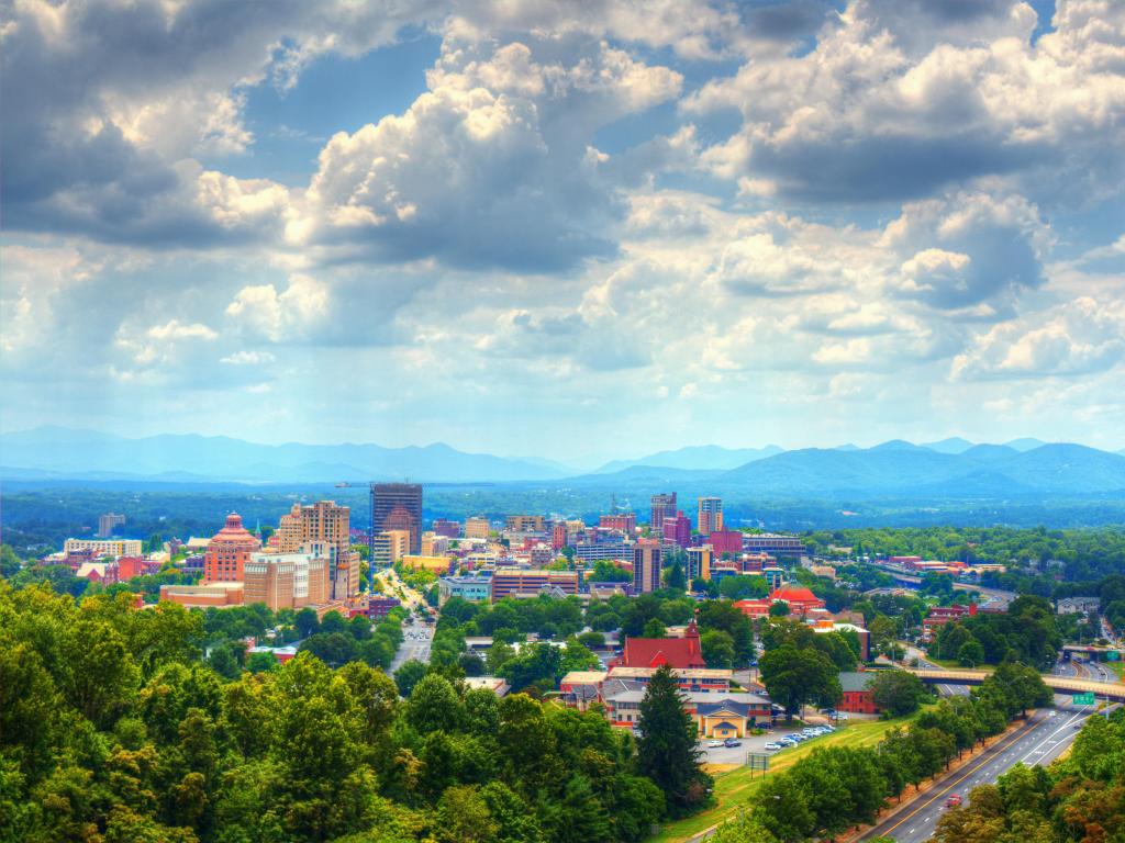 Asheville, North Carolina skyline nestled in the Blue Ridge Mountains.