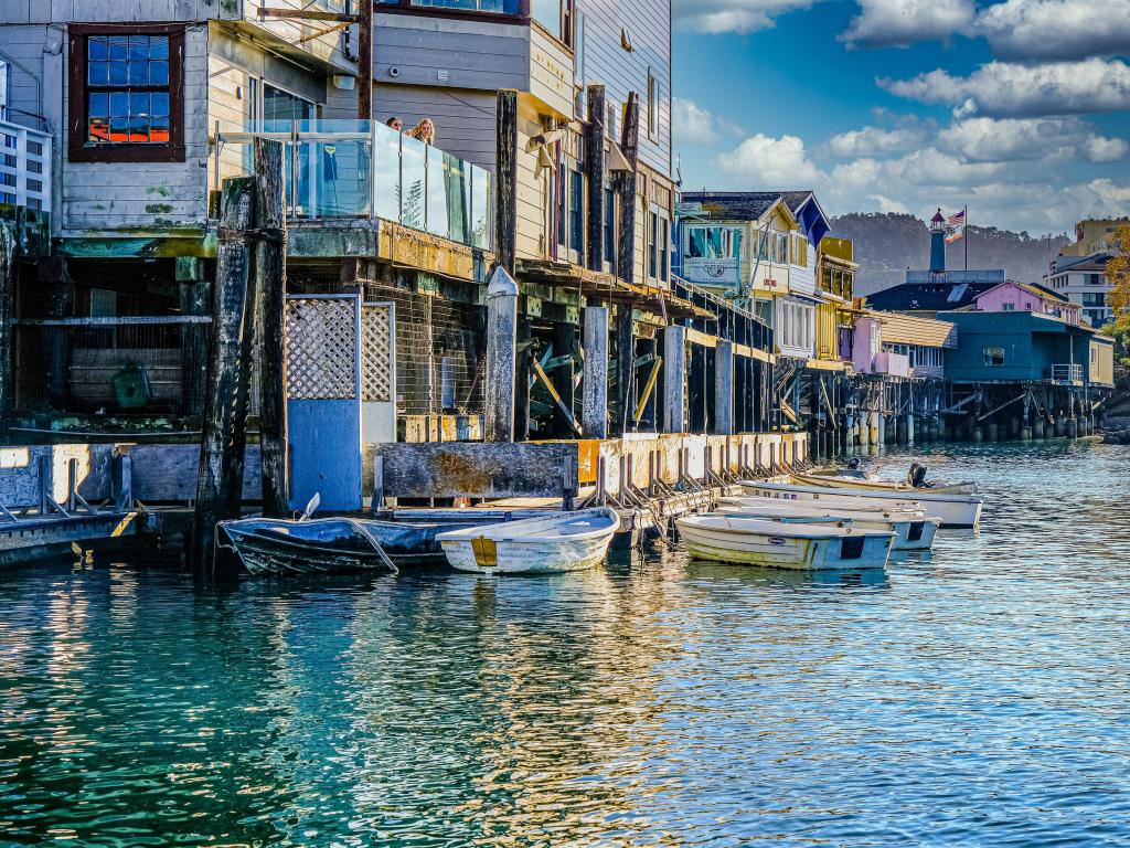 Monterey, California, USA with boats and buildings at the harbor taken on a sunny day.