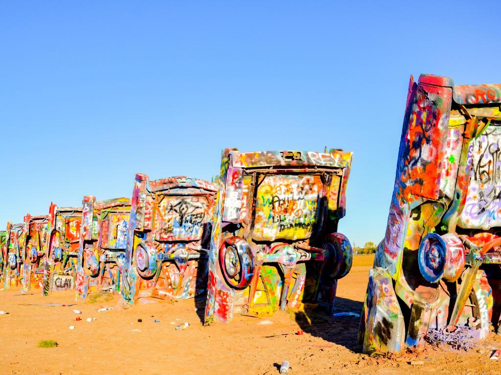 Cadillac Ranch, Amarillo, Texas, USA with a view of the public art installation and sculpture in Texas, U.S. created in 1974 by Chip Lord, Hudson Marquez and Doug Michels, of the art group Ant Farm