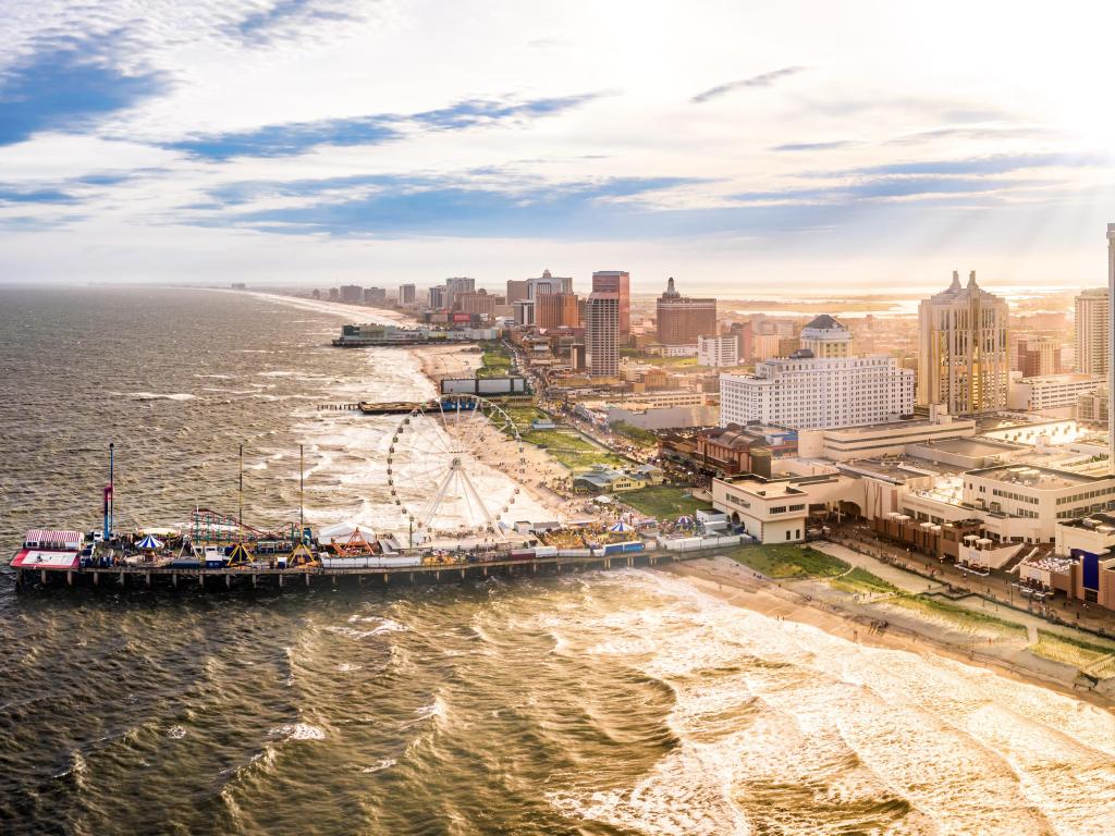 Late afternoon aerial panorama of Atlantic city along the boardwalk. Atlantic City achieved nationwide attention as a gambling resort and currently has nine large casinos.