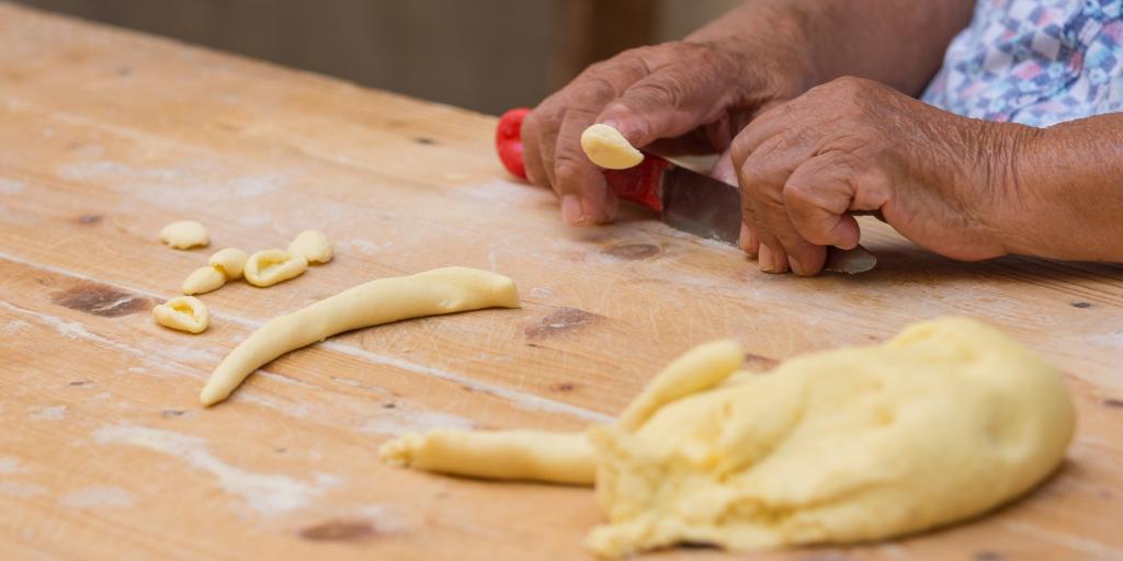 The hands of a nonna making orecchiette in Bari 