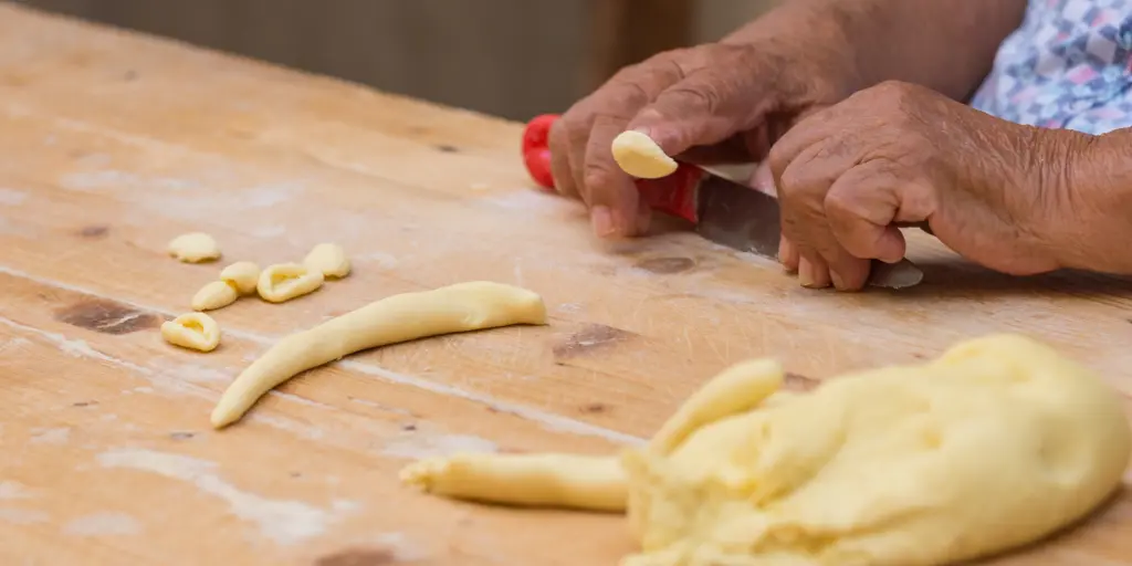 The hands of a nonna making orecchiette in Bari 