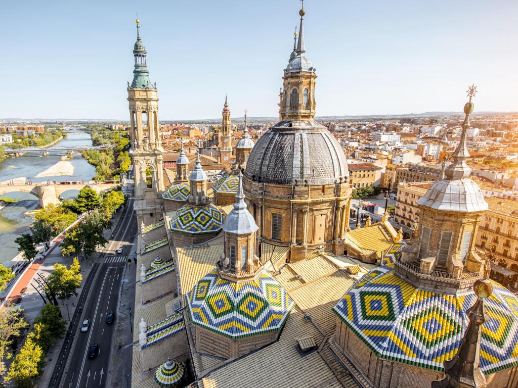 Aerial cityscape view on the roofs and spires of basilica of Our Lady in Zaragoza city in Spain