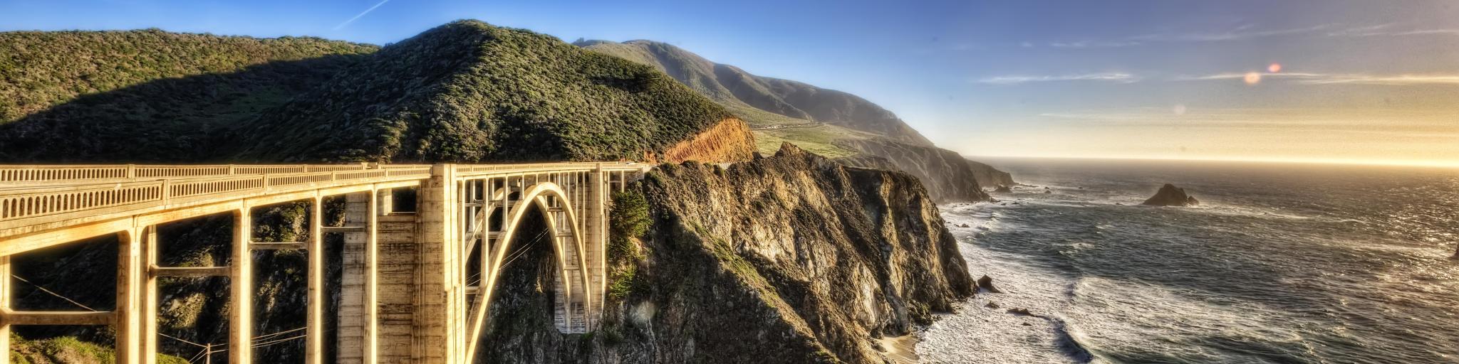 Bixby Creek Bridge, USA with the bridge and hills in the distance.