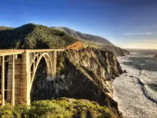 Bixby Creek Bridge, USA with the bridge and hills in the distance.