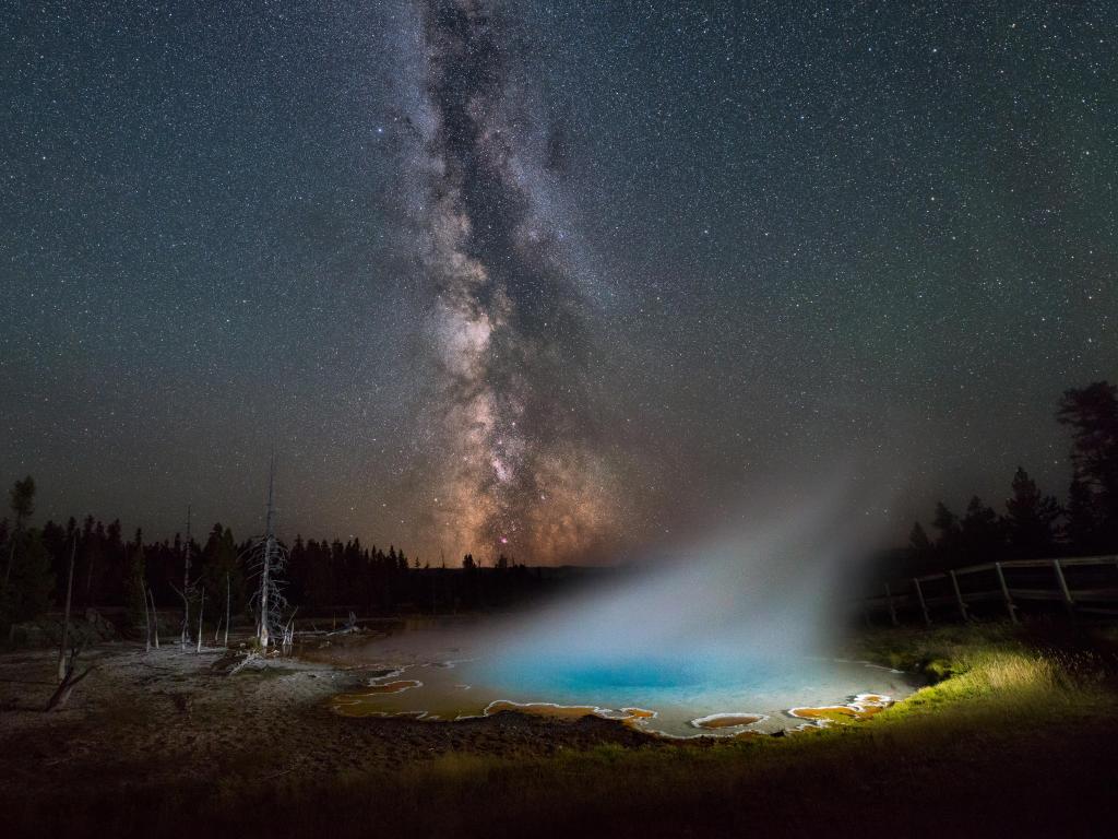 Silex Spring, Yellowstone National Park under the night sky.