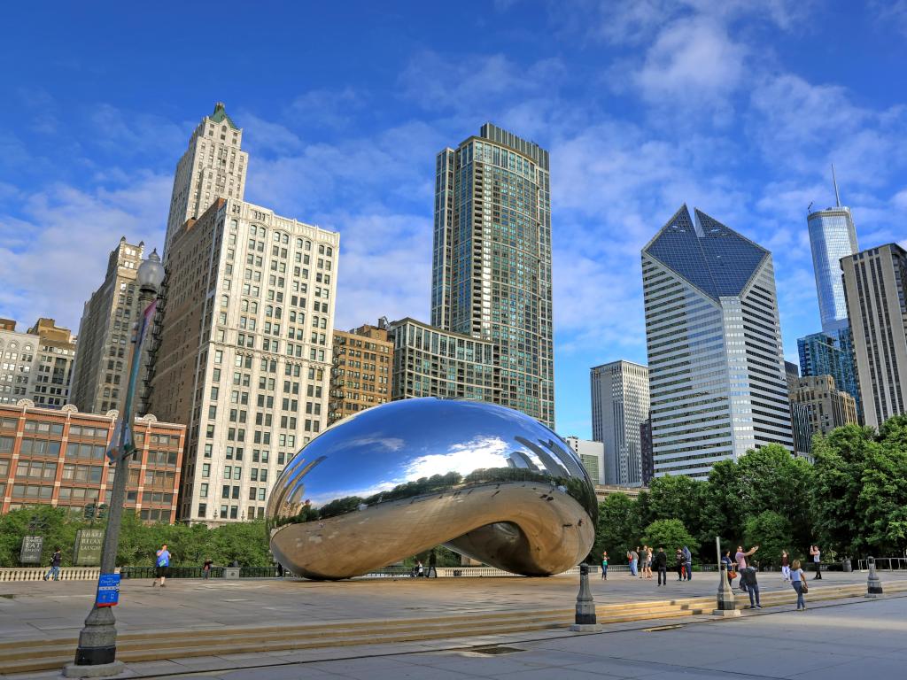 Chicago, Illinois, USA with a view of the 'Cloud Gate' also known as 'The Bean' in Millennium Park in Downtown Chicago.