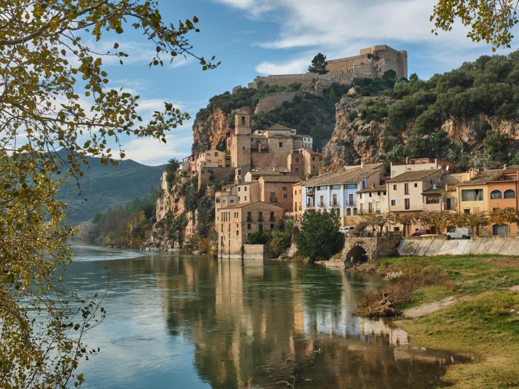Tarragona, Spain with a view of the Miravet village and its Templar castle on top of the hill on the banks of the Ebro river.