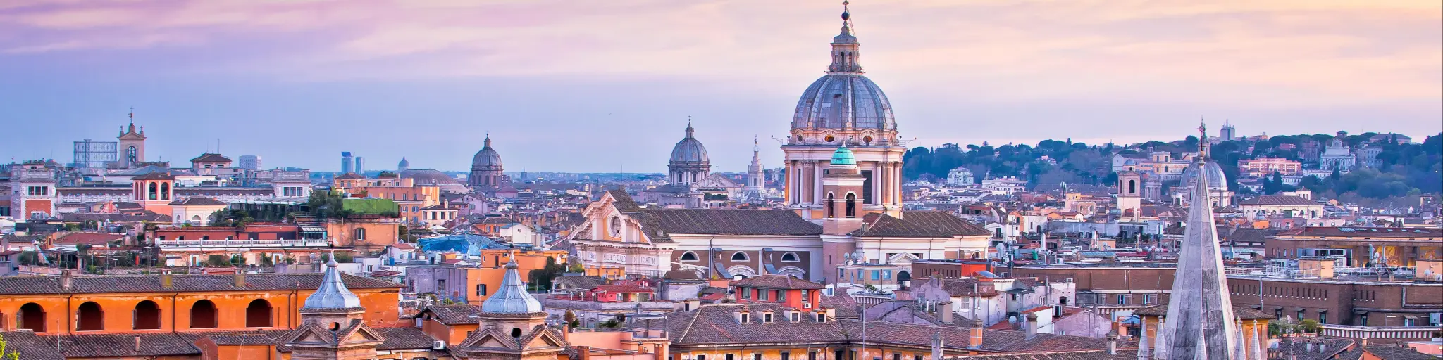 Rome rooftops and landmarks colorful sunset view, capital city of Italy