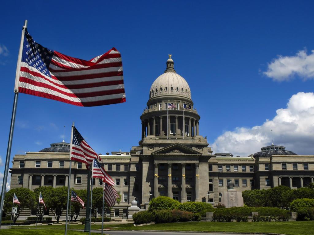 State capitol building with flags and sky, Idaho