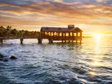 Pier at the beach in Key West, Florida USA at sunset.