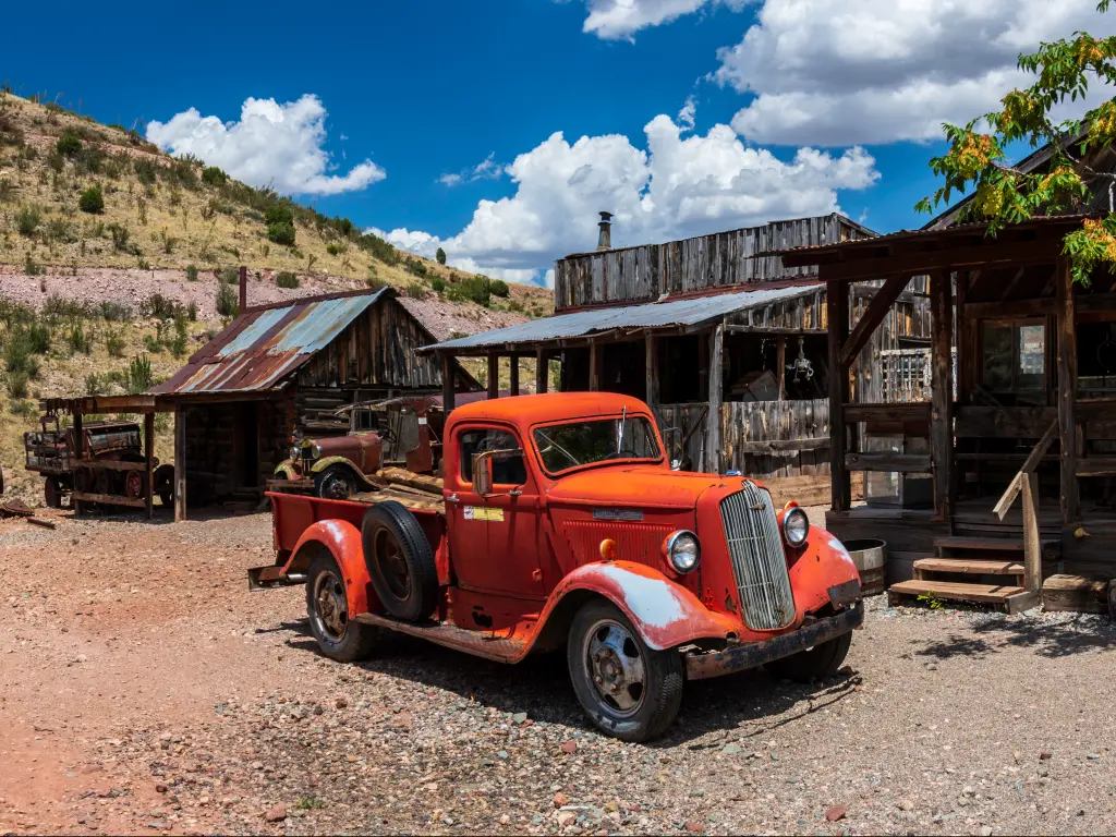 Rusty old pickup trucks in the Gold King Mine Ghost Town near Jerome, Arizona.