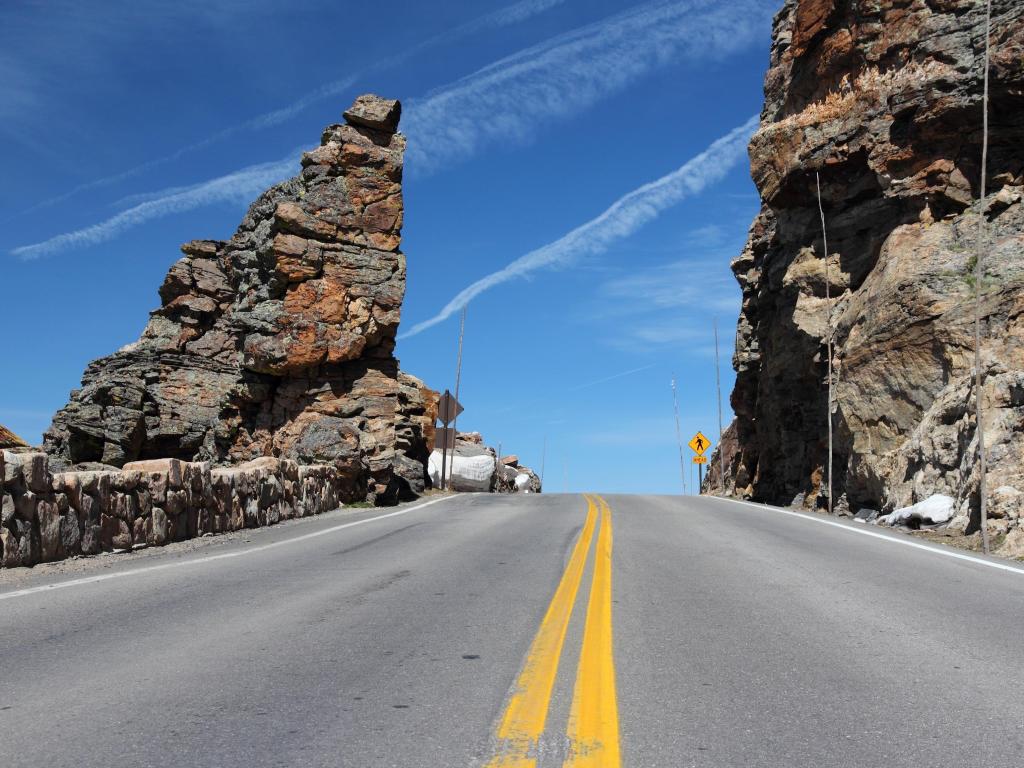 Travelling between giant rock formations and winding roads along Trail Ridge Road, Colorado, USA. 