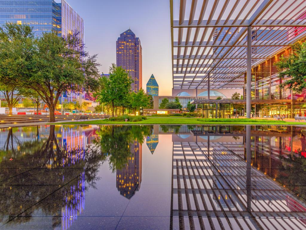 Dallas, Texas, USA downtown plaza and skyline at early evening.